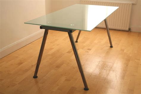 You get a generous work surface and a clever solution to keep cords in place underneath. Ikea galant glass desk, Purchase, sale and exchange ads ...