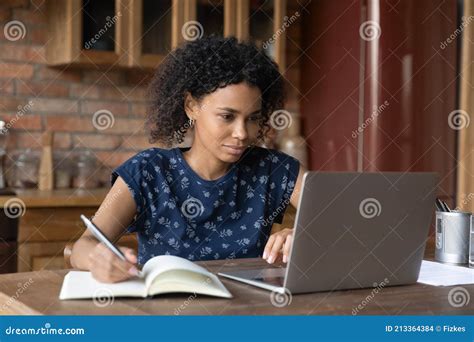 African Female Study By Laptop Take Notes Of Internet Lecture Stock