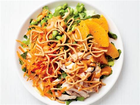 Lightly dressed chinese chicken salad with grilled chicken, crunchy wontons, toasted almonds, and sprinkled with sesame seeds over a crunchy napa cabbage and carrot salad. Asian Chicken Salad with Peanut Dressing Recipe | Food ...