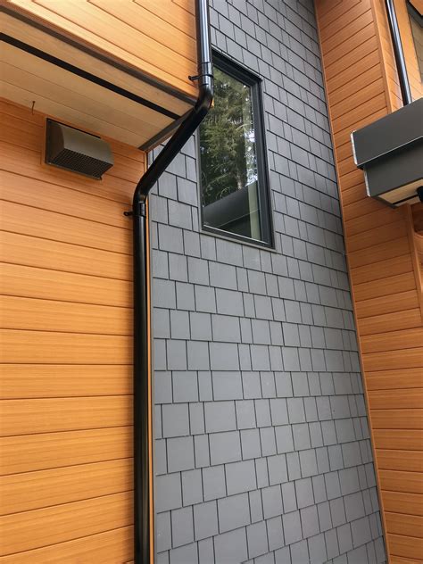 Black Lindab Rainline Gutter installation in Whistler. A fun project on ...