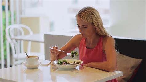 Food People And Leisure Concept Hungry Woman Eating Salad For Lunch