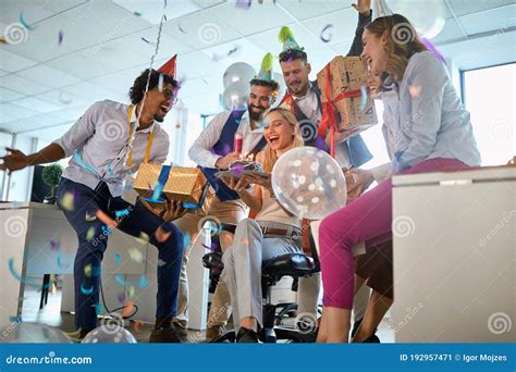 Young Businesspeople Celebrating Birthday In The Office Office