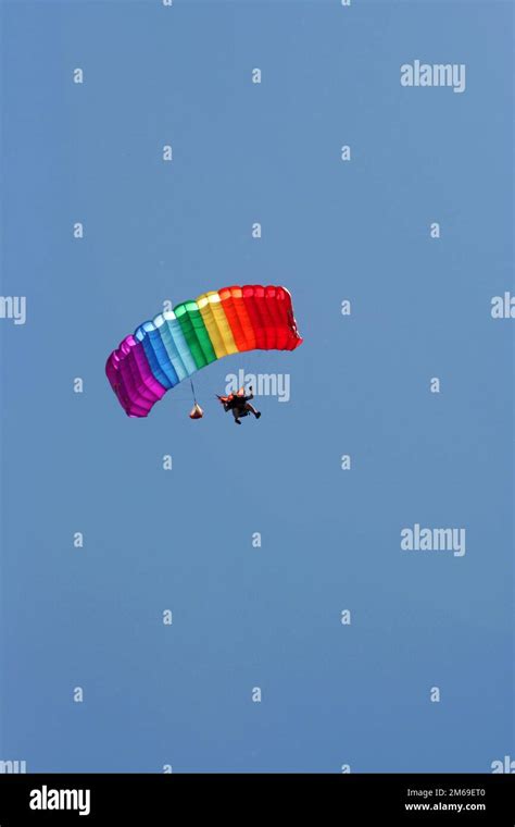 Parachuter With Colored Parachute Stock Photo Alamy