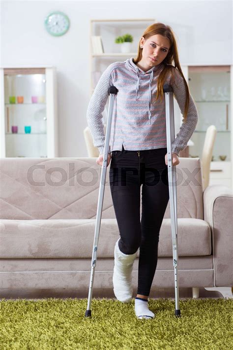 Young Woman With Broken Leg At Home Stock Image Colourbox