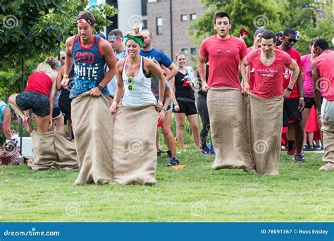 Young Adults Participate In Sack Race At Atlanta Field Day Editorial
