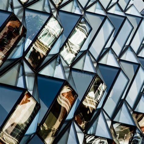 Architectural Geometric Glass Facia On A Modern Building Stock Photo