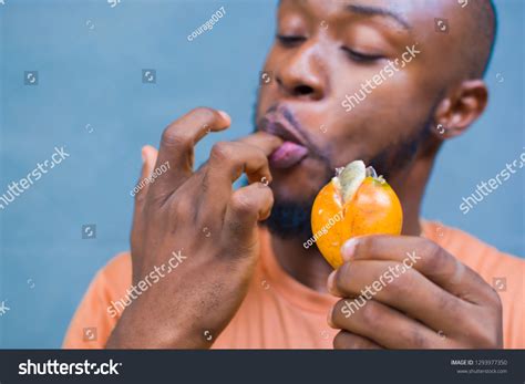 Photo De Stock Young Black Man Licking Hand After 1293977350 Shutterstock