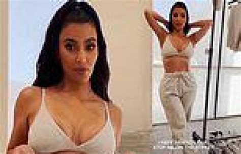 Kim Kardashian Flashes Her Busty Cleavage And Shows Off Her Toned Abs As She Trends Now