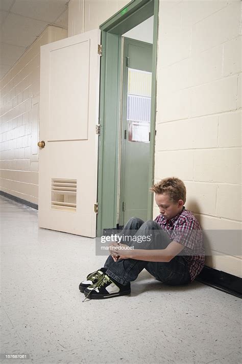 Young Boy Sitting Alone Out Of Classroom High Res Stock Photo Getty