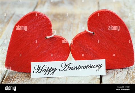 Happy Anniversary Card With Two Red Wooden Hearts Stock Photo Alamy