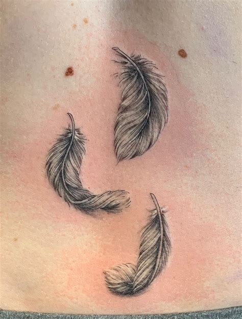 Https://tommynaija.com/tattoo/falling Feathers Tattoo Designs