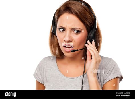 Nervous Young Woman With Headset On Her Head Stock Photo Alamy
