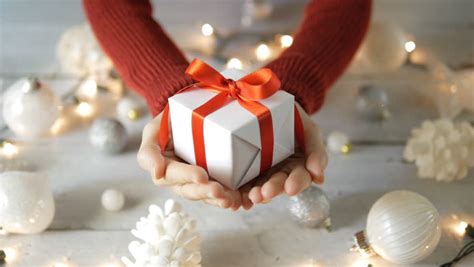 Hands Holding A Christmas Ornament Ball Image Free Stock Photo