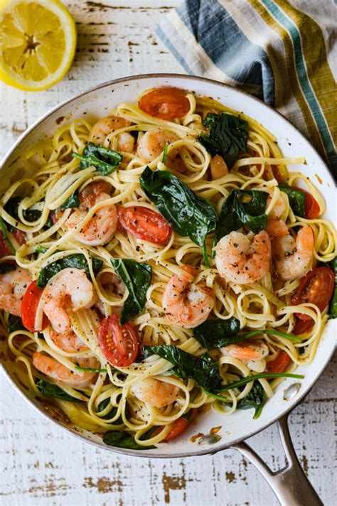 shrimp scampi pasta with spinach and cherry tomatoes is fresh and bright for a summertime meal