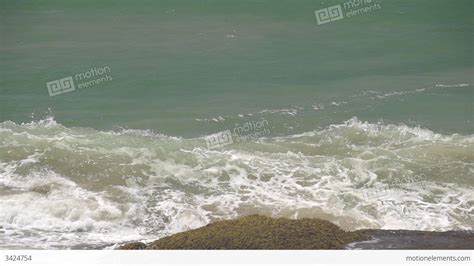 Slow Motion Ocean Waves Hitting Rocks Stock Video Footage 3424754