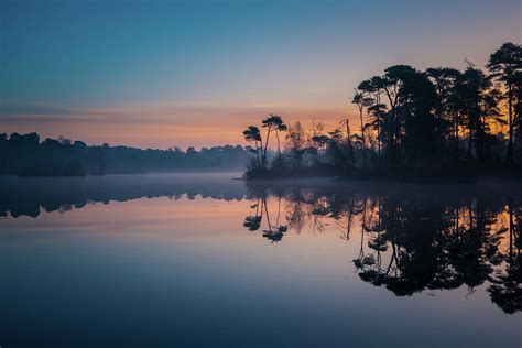 Sunrise Over The Misty Lake Photograph By Ronne Vinkx Fine Art America