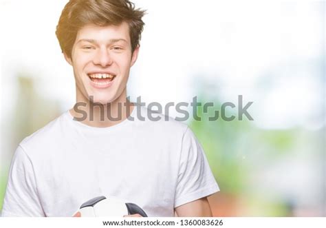 Young Man Holding Soccer Football Ball Stock Photo 1360083626