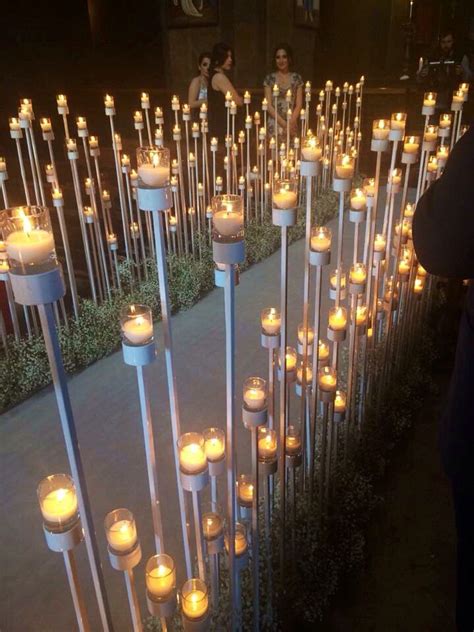 Many Lit Candles Are Placed In The Ground