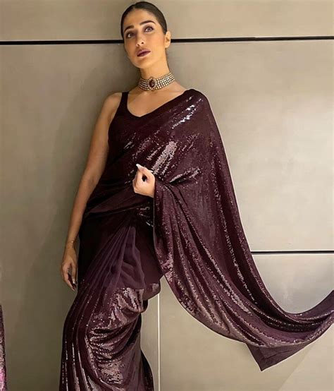 Raai Laxmi Glitters In A Wine Sequinned Saree At A Wedding Reception