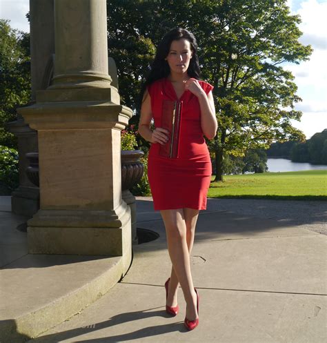 Tricia Takes A Stroll Outdoors Wearing A Tight Red Dress