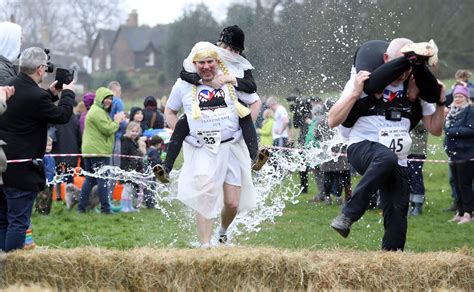 Uk Wife Carrying Race See Best Pictures Of Famous Championship As It Returns To Surrey For 11th