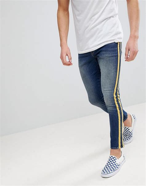 Asos Super Skinny Jeans In Mid Wash With Yellow Side Stripes In Blue