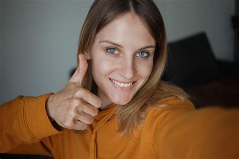 Premium Photo A Girl Takes Selfies And Shows Her Class Sign