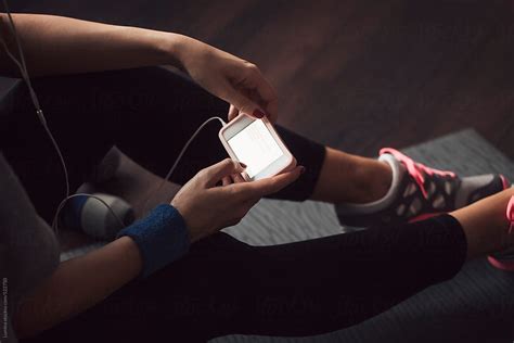 Woman Texting At The Gym By Stocksy Contributor Lumina Stocksy