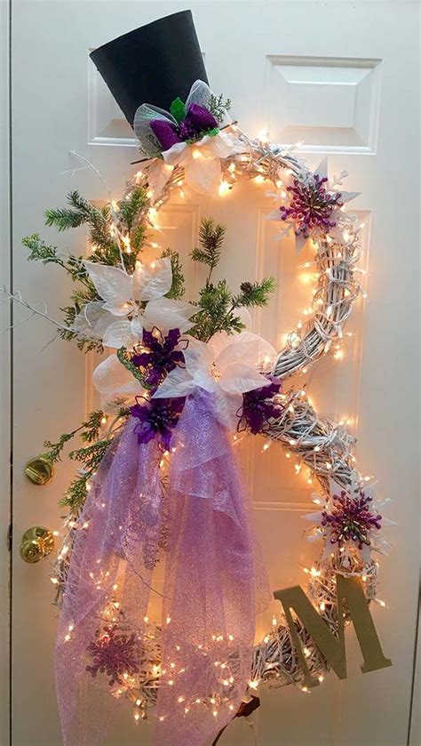 A Wreath With Purple And White Flowers Is Hanging On The Front Door