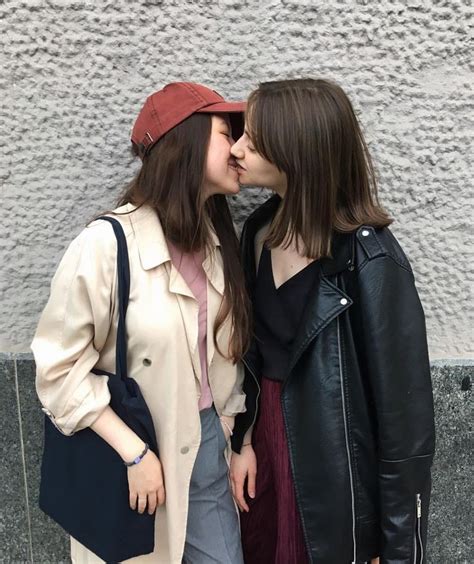 kissing in the streets cute lesbian couples lesbians kissing rain jacket