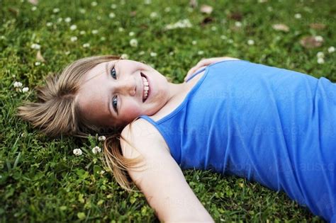 Image Of Pretty Blue Eyed Tween Girl Lying In The Grass Austockphoto