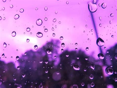 Rain Drop On Window Car In Purple Light Water Splash On Glass Rainy