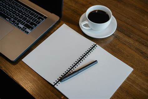 Laptop And Notepad Near Cup Of Coffee · Free Stock Photo