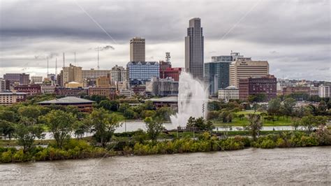 A Fountain And Riverfront Park With View Of Skyline Downtown Omaha