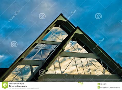 Reflection Of A Sky In A Triangle Glass Shape On A