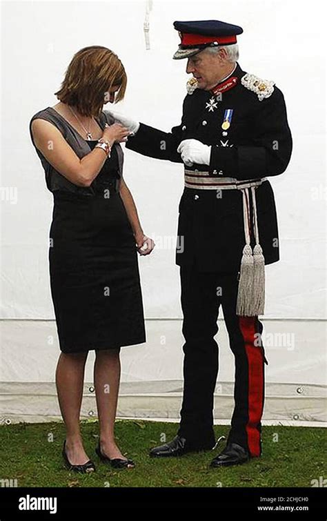 Karen Upton The Wife Of Warrant Officer Sean Upton Is Presented With