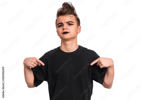 Portrait Of Teen Boy With Spooking Make Up Pointing On Himself