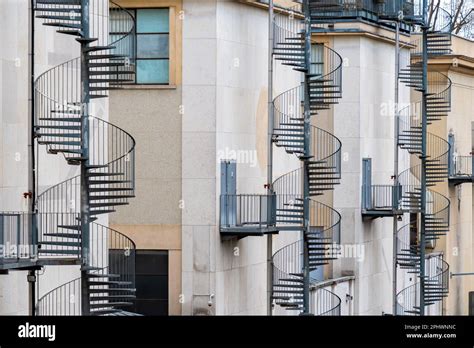 Exterior Metal Spiral Fire Escape Stairs Leading To Emergency Exits At