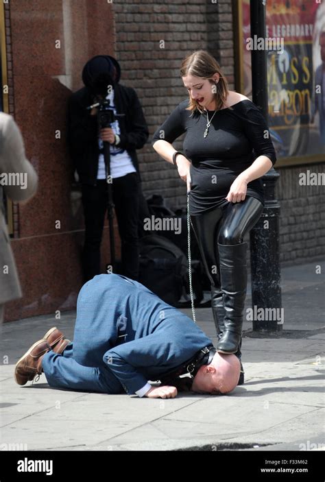 A Man Being Publicly Humiliated By A Dominatrix In The Streets Of Soho