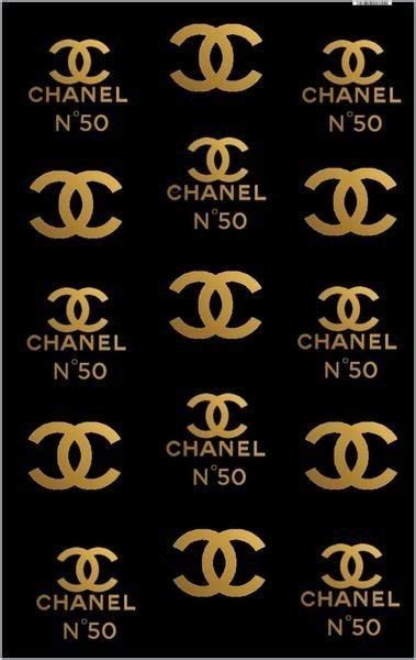 The Chanel Logo Is Shown In Gold Foil On Black Background With