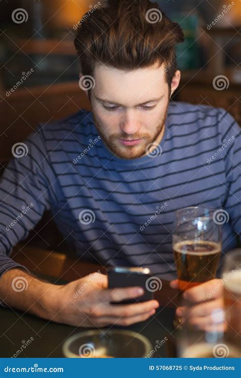 man with smartphone drinking beer at bar stock image image of mobile beer 57068725