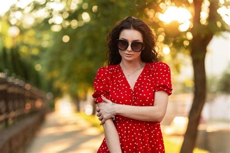 Premium Photo Portrait Of Stylish Pretty Woman With Sunglasses In Fashion Red Dress Walk On