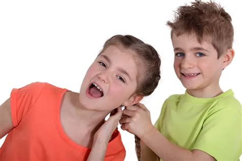 Boy Pulling Girls Hair — Stock Photo © Photography33 9214659