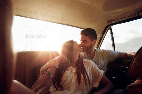 Beautiful Couple Kissing In Back Seat Of A Car Stock Photo By Jacoblund