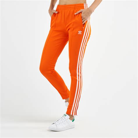 The elastic waist and open hem legs make for a comfortable fit while side. adidas Originals Women's SST Track Pants | Track Pants ...