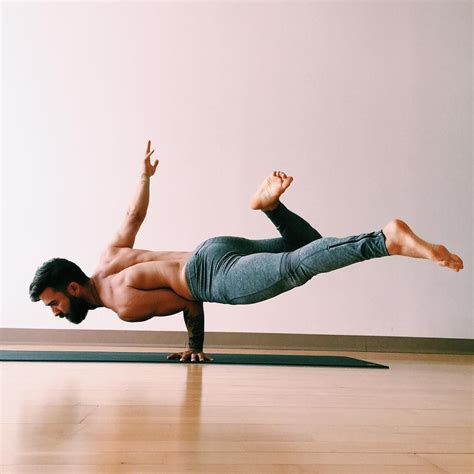 A Man Is Doing A Yoga Pose On The Floor