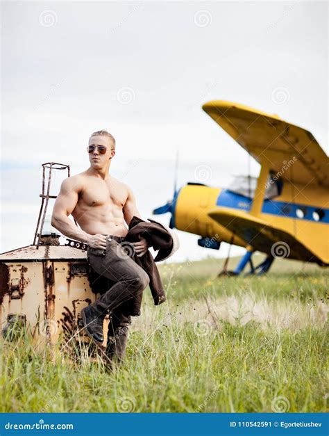 A Man In Front Of A Airplane Stock Image Image Of Muscle Military