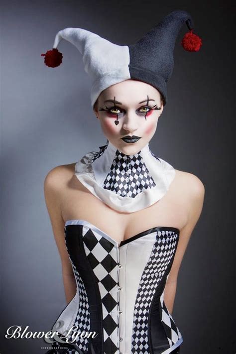A Woman With Makeup On Her Face Is Dressed In A Corset And Hat