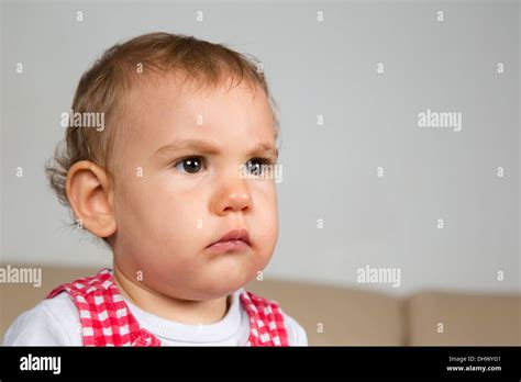 Portrait Of A Sad Or Angry Looking Baby Stock Photo Alamy