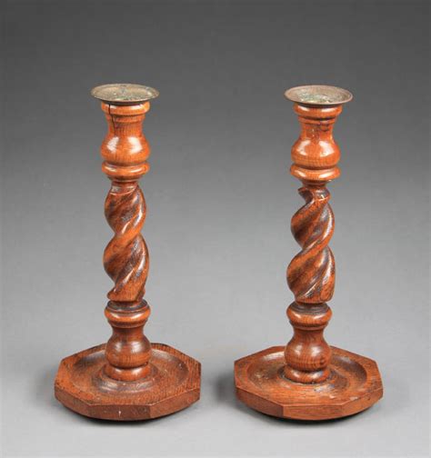 A Pair Of Spiral Turned Mahogany Candlesticks